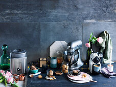 Kitchen utensils, utensils and biscuits on black tabletop