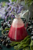 Homemade currant and egg liqueur in a glass caraffe