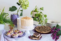 A cake buffet with peanut cake and biscuits