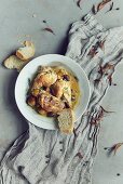 Chicken with olives and white bread