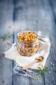 Homemade crunchy muesli with orange and dried apricot