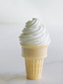Cone of soft vanilla ice cream