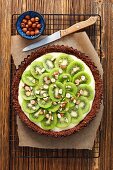 Chocolate tart with vanilla cream and kiwi