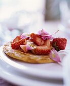 Strawberry tart decorated with petals