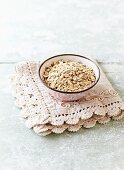 Organic oat flakes in a ceramic bowl