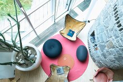 View down onto two Butterfly chairs on round rug