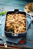 Bread gratin with minced beef and olives