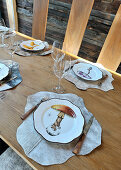 Table set with plates with mushroom motifs and animal-skin place mats