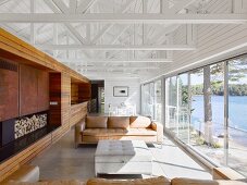 Living room in modern, architect-designed house with exposed roof structure