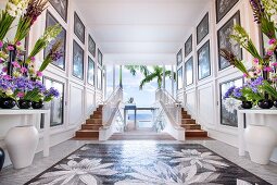 Panelled walls and flowers in glamorous foyer