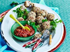 Chicken sesame meatballs with sweet and sour tomato sauce