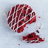 Red velvet cupcake, half eaten
