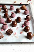 Date candies with dark chocolate and cherries