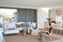 Open-plan living room with sliding terrace doors in modern holiday home