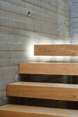 Indirect lighting emphasising floating effect of wooden stair treads