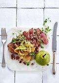 Pan-fried sirloin with shaved pear, pecan nuts and brown butter