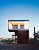 Cubist house with glass wall and exterior staircase