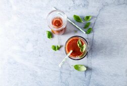 Tomato smoothie with basil (seen from above)