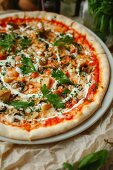 Vegetarian pizza with tomatoes, mushrooms and parsley