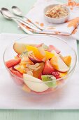 Mixed fruit salad with almond flakes
