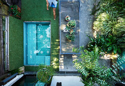 View from above into a small courtyard garden with a mini pool