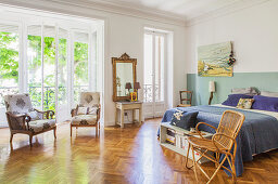 Large bedroom with floor-to-ceiling windows and herringbone parquet floor