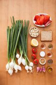 Ingredients for grilled spring onions with Romesco tomato and red pepper sauce