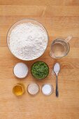 Ingredients for snail-shaped bread with pesto