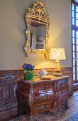 Antique chest of drawers and mirror in Château des Grotteaux
