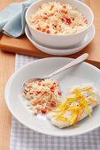 Steamed rice with red pepper and a fillet of fish