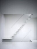 White zig-zag staircase in white interior