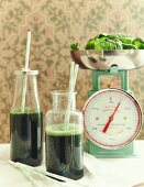 Spinach and spirulina smoothies in bottles