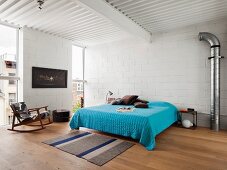 Double bed with blue cover