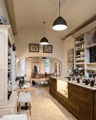 Kitchen counter and high ceiling in inviting sales room