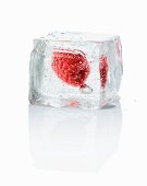An ice cube with a rapsberry