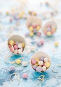 Chocolate mini eggs in egg shells