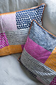 Multicoloured scatter cushions on sofa