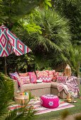 Outdoor sofa and exotic decorations in garden seating area