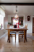 Festively set table in rustic dining room