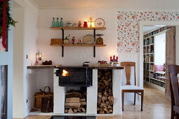 Old wood-fired cooker with masonry firewood compartment