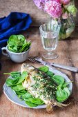 Fried carp with herbs and garlic