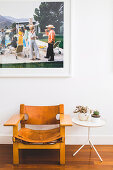 Vintage leather chair and side table under large format photo