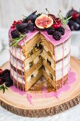 Rustic drip cake with fresh fruit sliced