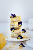 Stacked lemon slices decorated with horned violets