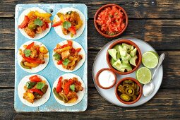 Mini fajitas with chicken, pepper and tomato salsa