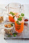 A carrot and pineapple drink served with vegetable couscous