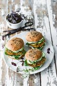Burgers with spelt patties, herb mayo, spinach, cucumber, and cress