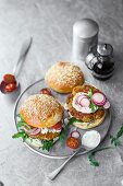 Burgers with seitan and millet patties, radishes, and a chive dip