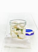 Lacto fermented daikon radishes in a mason jar