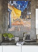 A large painting on a stone-coated wall above a sink
